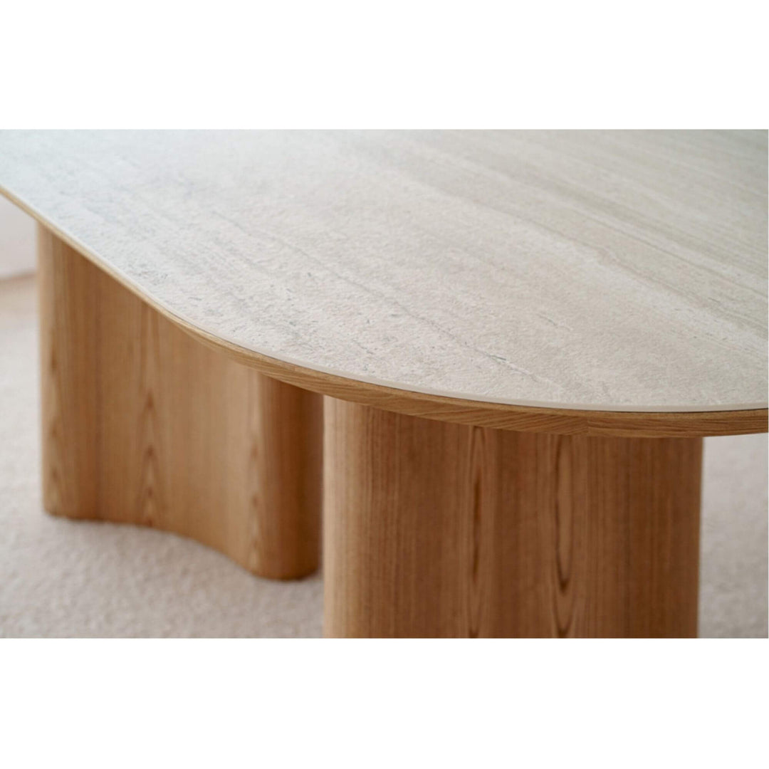 Close-up of the ash veneer base of the oval dining table.