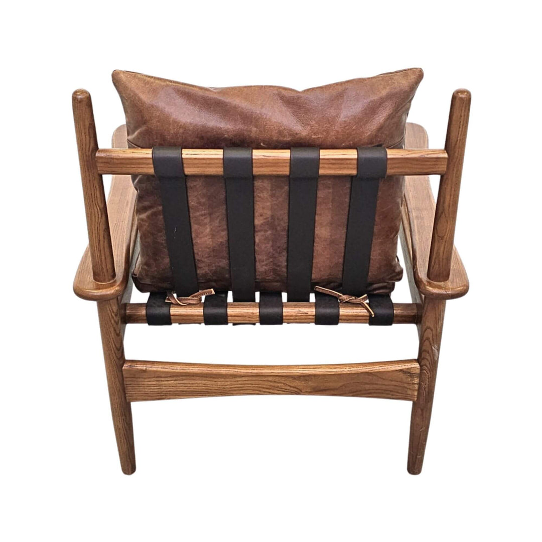 Back view of Asikni chair with leather cushion and strap details