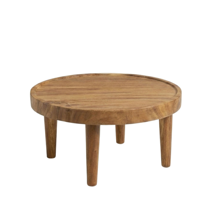 Front view of medium Asterope Suar Wood Coffee Table showing its round silhouette and solid legs.