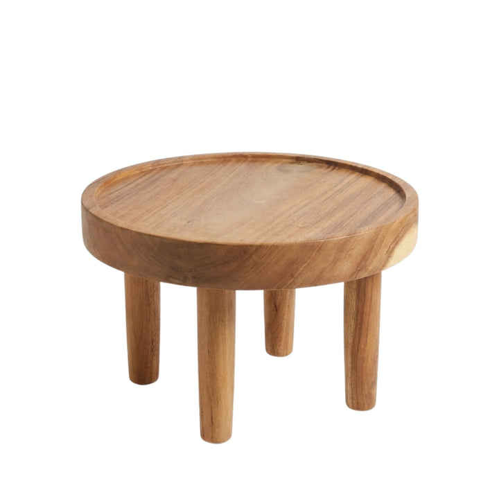 Front view of small Asterope Suar Wood Coffee Table showing its round silhouette and solid legs.