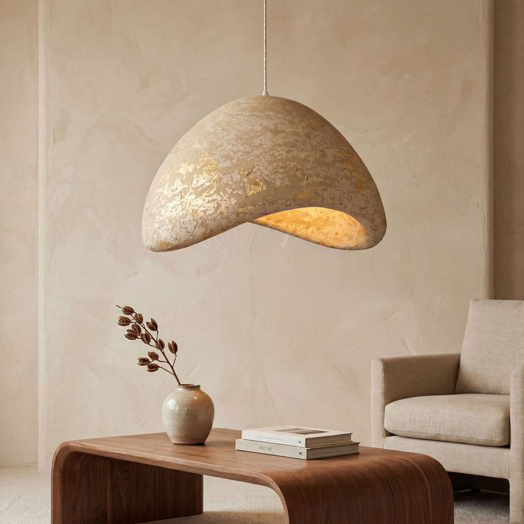 Front view of the Aster pendant lamp showing its organic sculptural shape and textured finish.