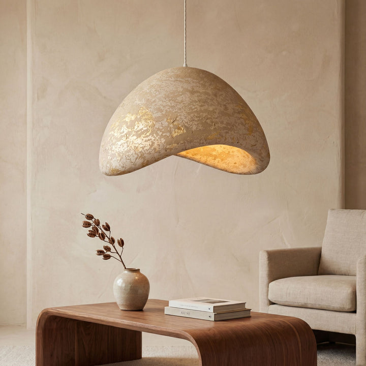 Front view of the Aster pendant lamp showing its organic sculptural shape and textured finish.