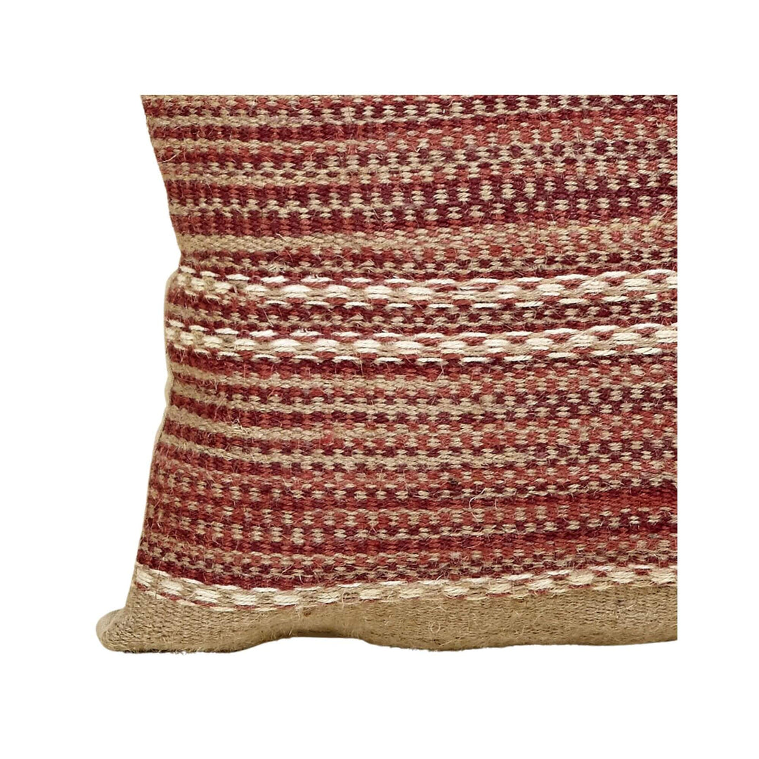 Close-up of Aura Jute Cushion in terracotta and natural beige jute showing detailed woven stripes.