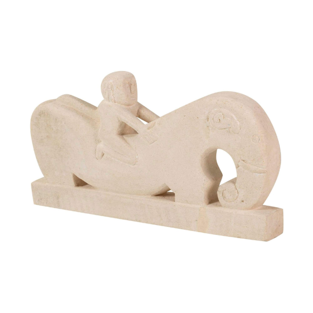 Angled view of full stone rider sculpture