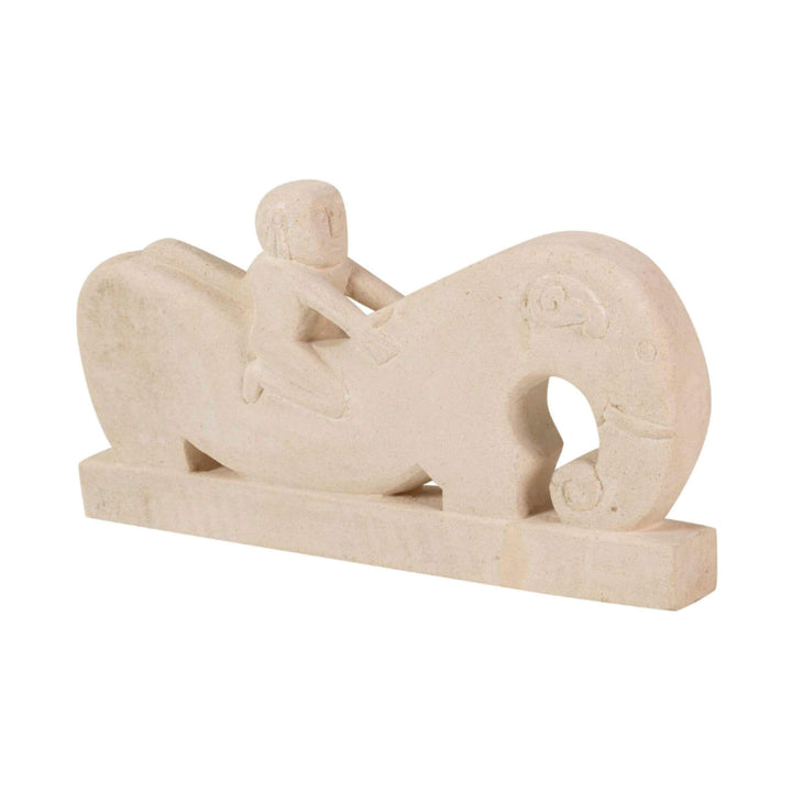 Angled view of full stone rider sculpture