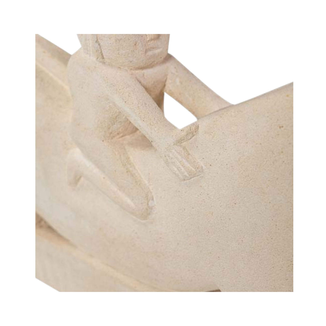 Close-up of rider carving on stone sculpture