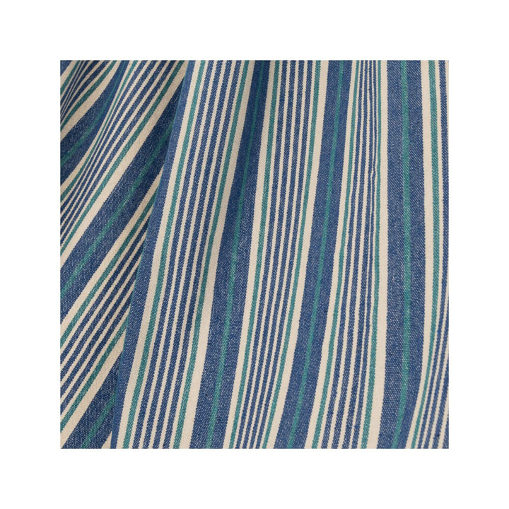 Close-up of blue and white striped hammock fabric.