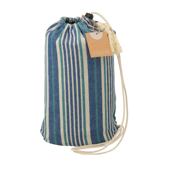 Azure hammock stored inside its matching striped fabric bag.