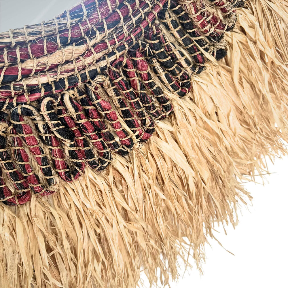 Close-up of Angkasa Mirror made of abaca, sisal, and cotton with a natural fiber circular frame.