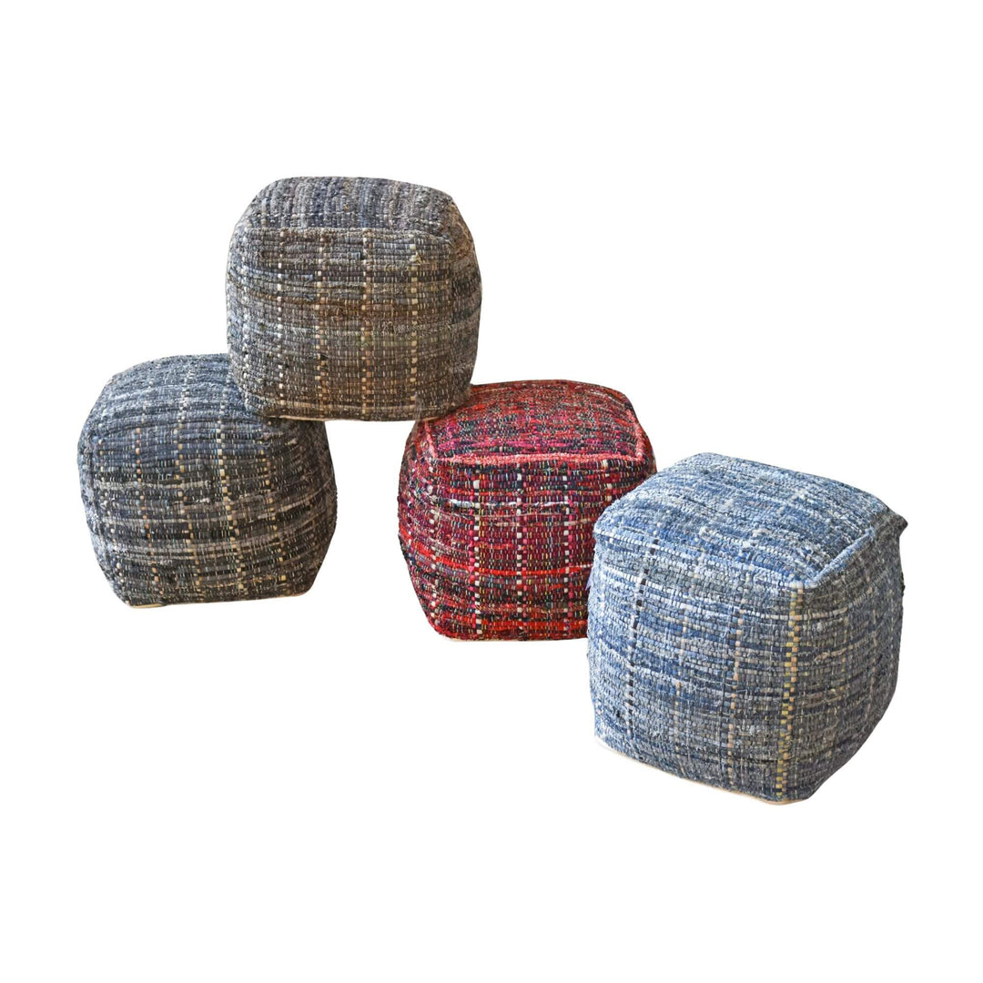 Handcrafted BAGA poufs in grey-blue, khaki and red woven fabric arranged together.