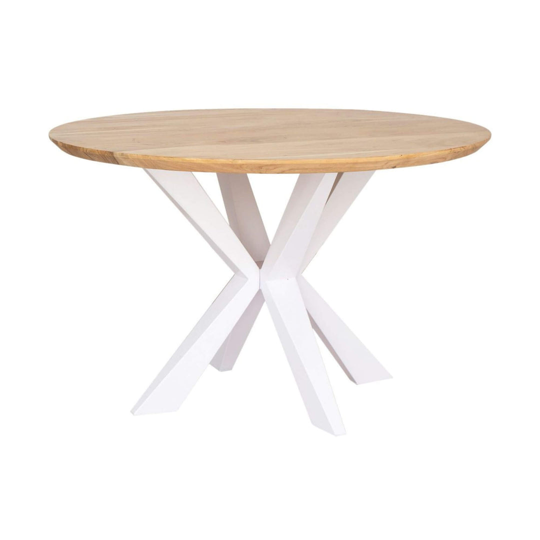 Round Bahia dining table with natural acacia wood top and white metal cross legs, 130 cm diameter.