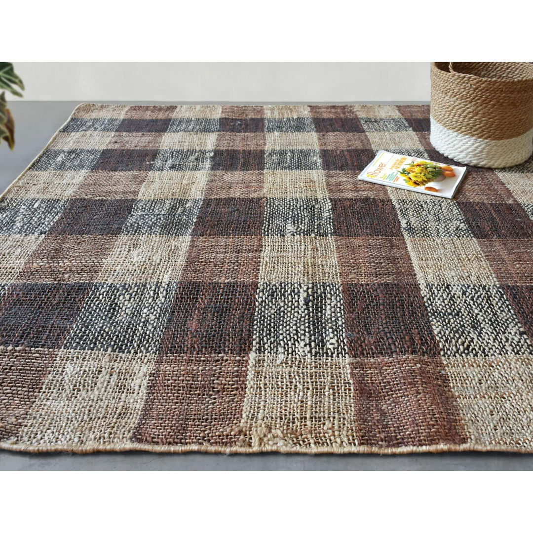 Baina hemp rug with earthy checked pattern displayed in a room setting.

