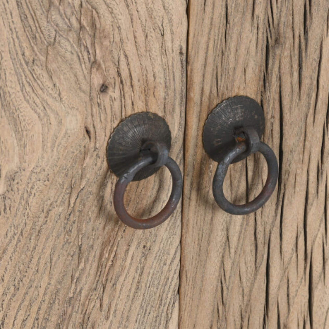 Close-up of the elm wood texture and metal handles.