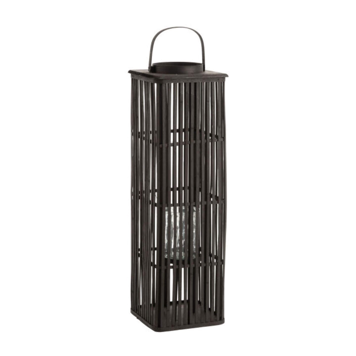 Black bamboo floor lantern showing open slatted design and internal glass candle holder.

