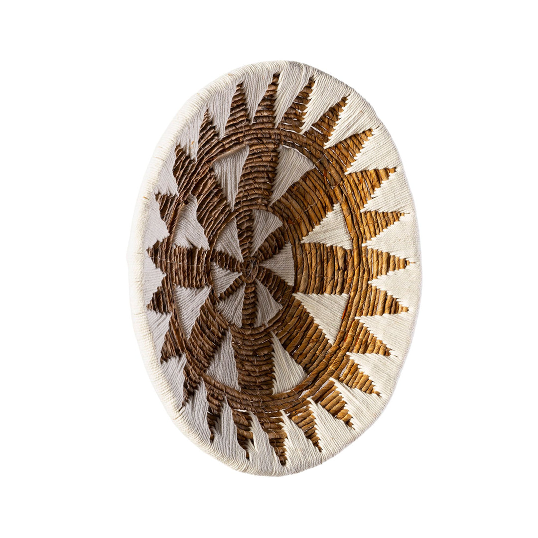 Side view of the decorative plate emphasizing its slim profile and layered materials.