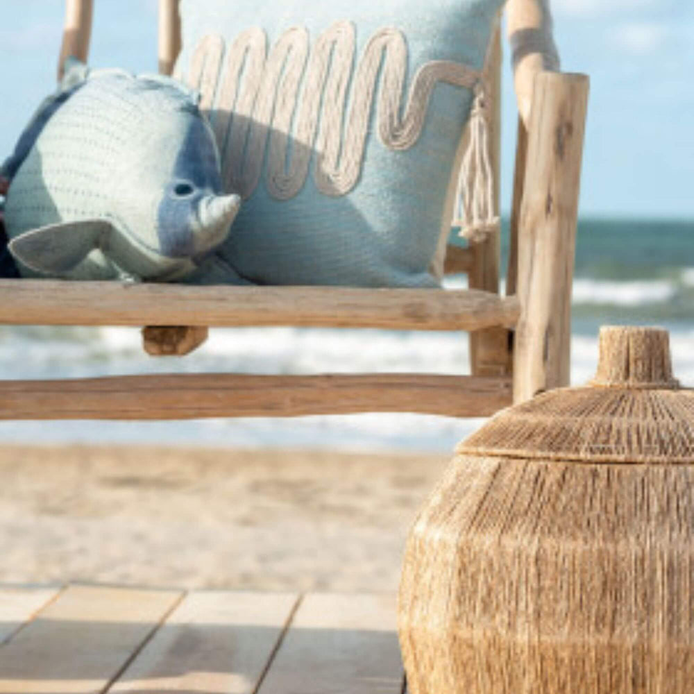 Lifestyle scene of Banana Leaf baskets styled outdoors on a deck