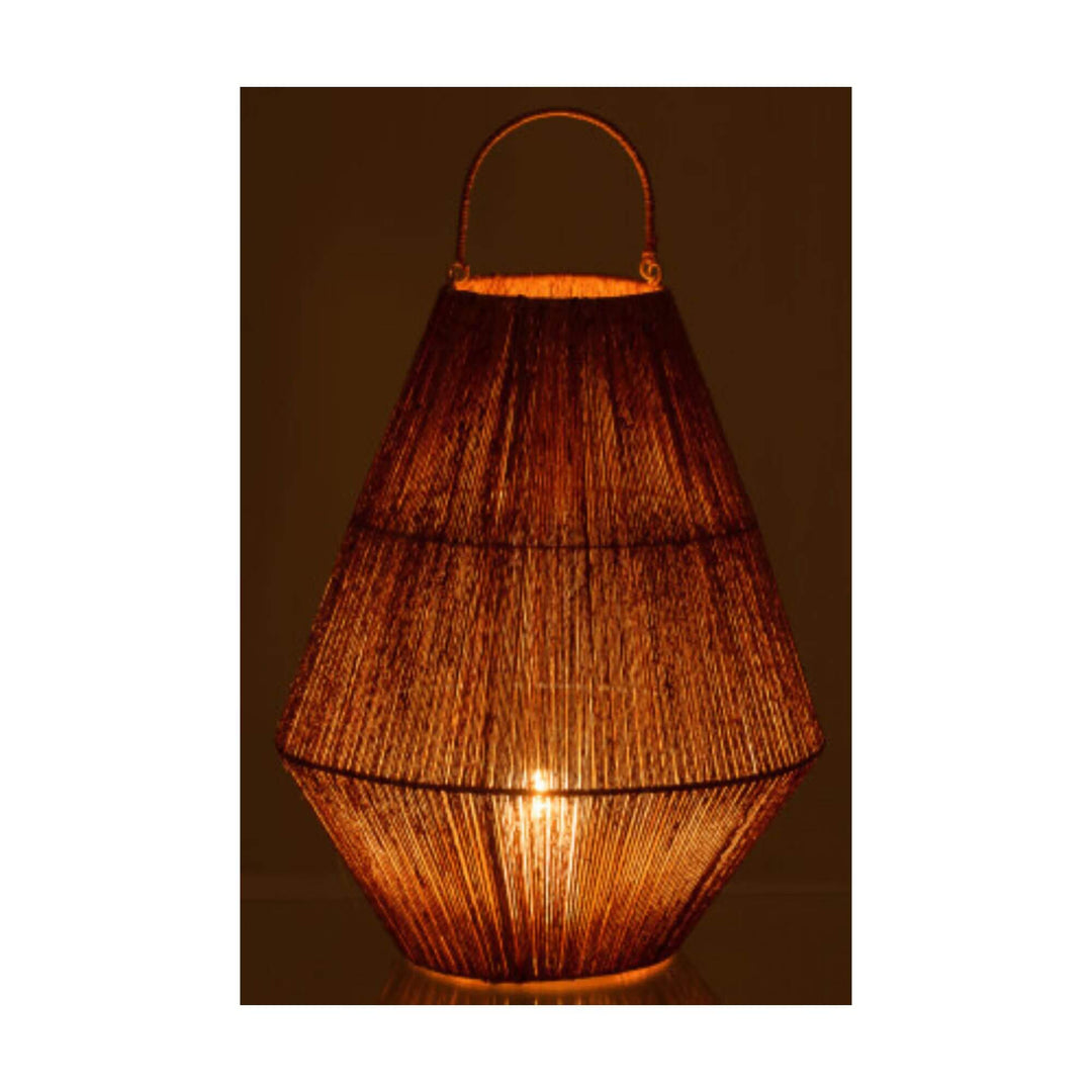 Natural jute lantern illuminated in a dark setting