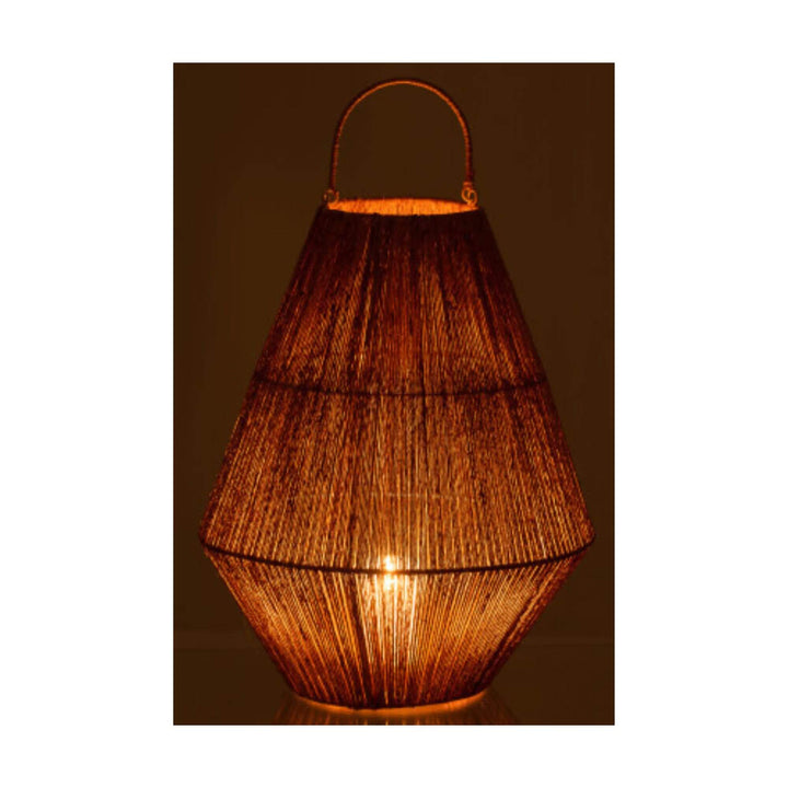 Natural jute lantern illuminated in a dark setting
