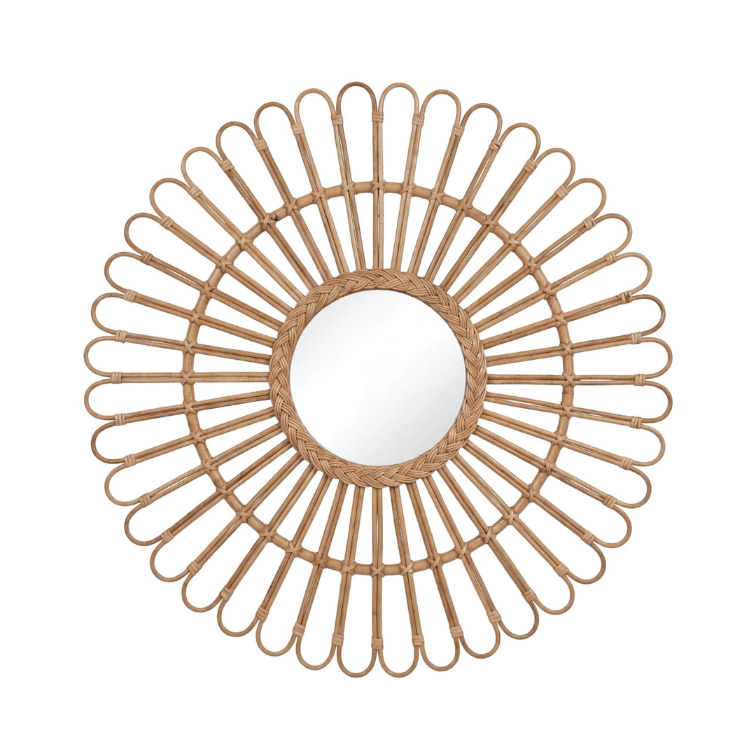Front view of the Banana mirror showing its round center and sculptural sunburst rattan frame.