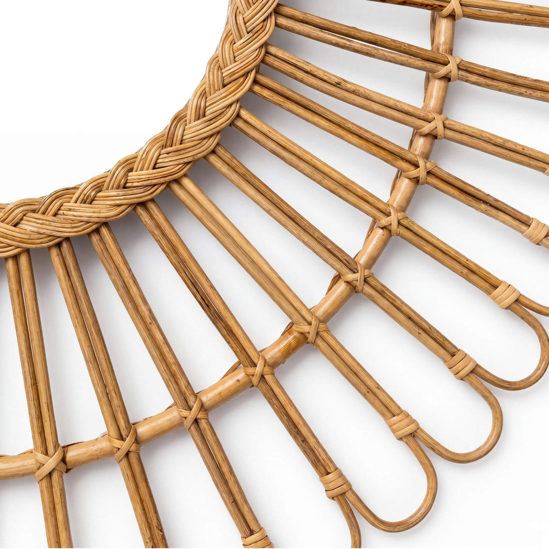 Close-up detail of the woven rattan frame showing the handcrafted looped pattern and natural texture.