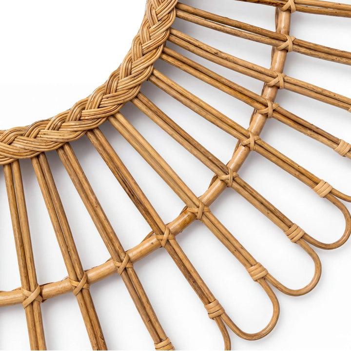 Close-up detail of the woven rattan frame showing the handcrafted looped pattern and natural texture.
