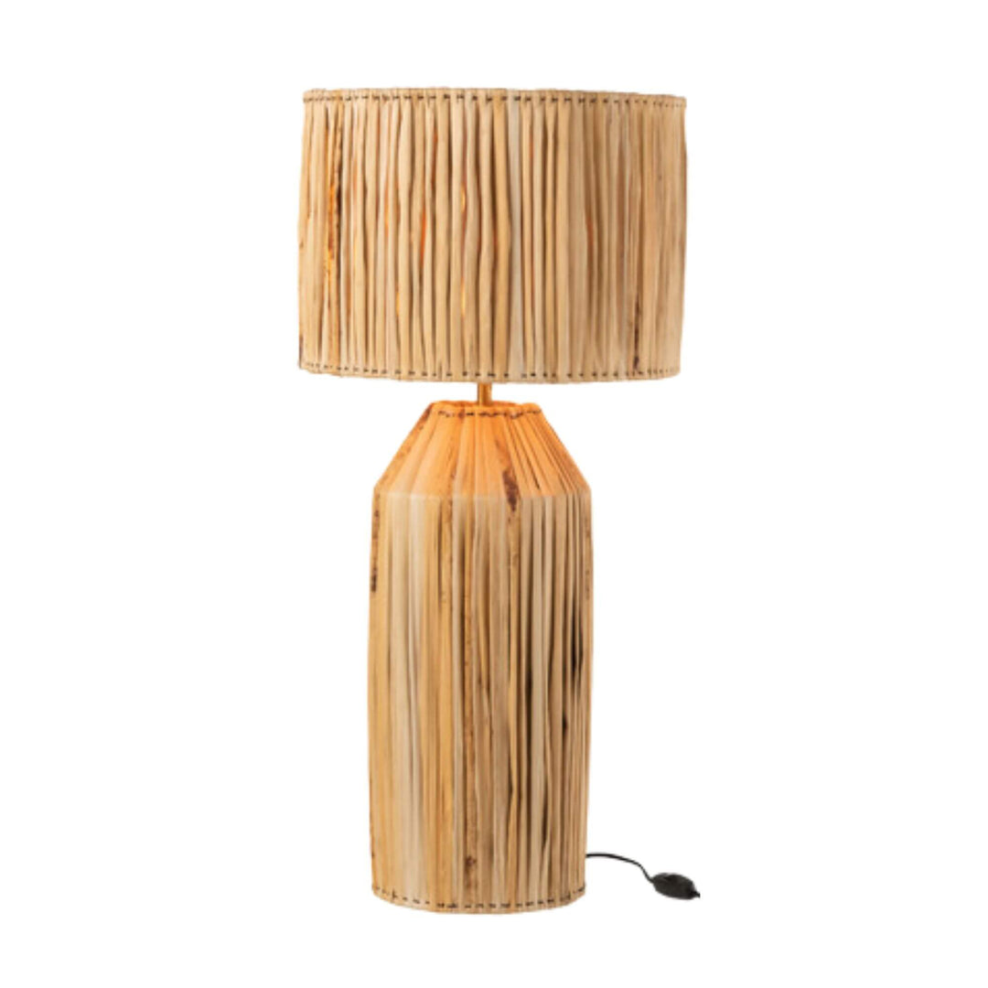 Large Banana table lamp illuminated, showing warm ambient glow.