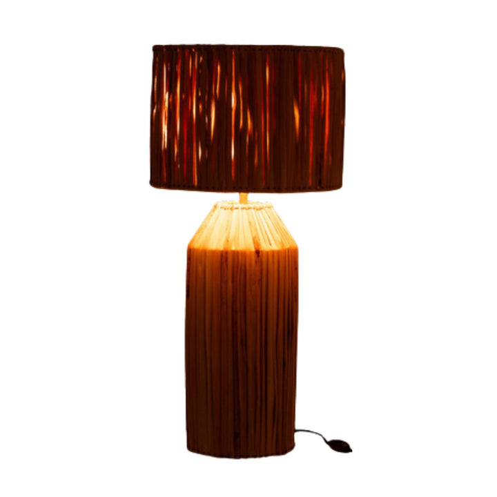 Large Banana table lamp on, highlighting vertical banana leaf strands.