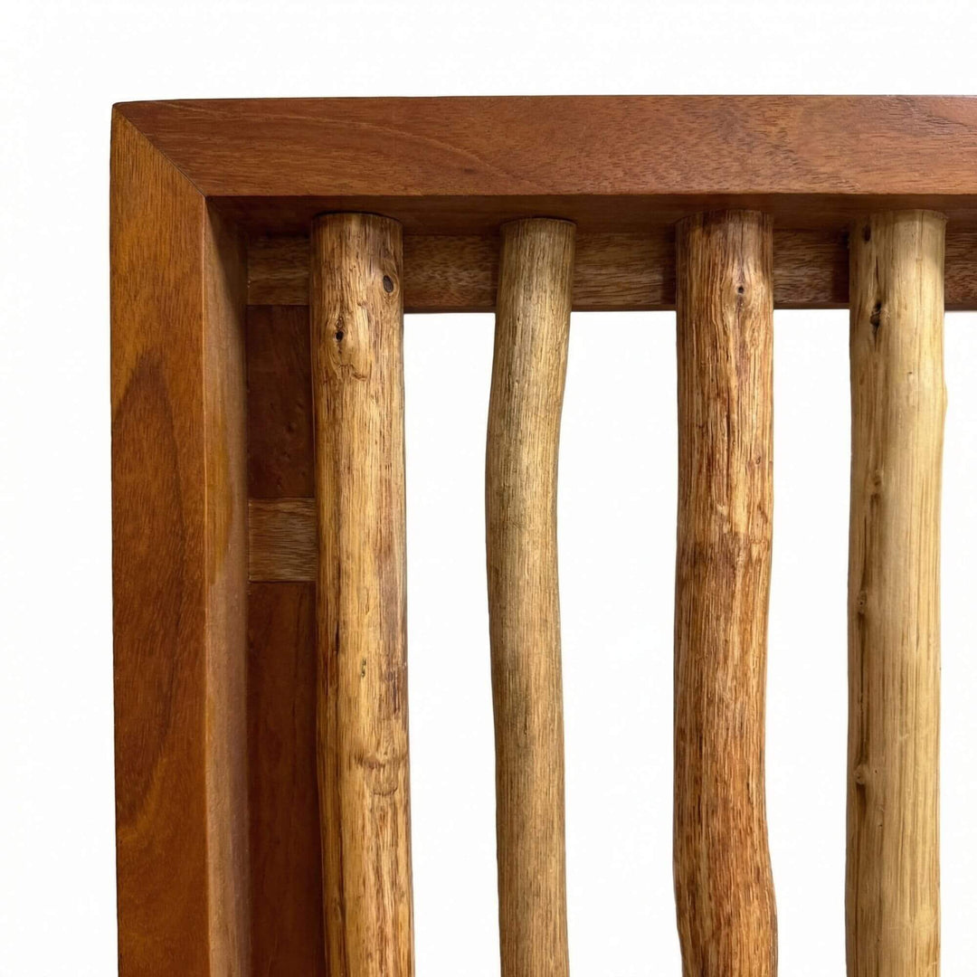 Close-up detail of the teak frame and vertical slats highlighting natural wood texture and variation.
