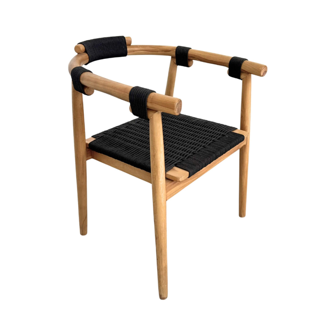 Angled view of Baros Dining Chair emphasizing natural teak grain and black rope weaving.