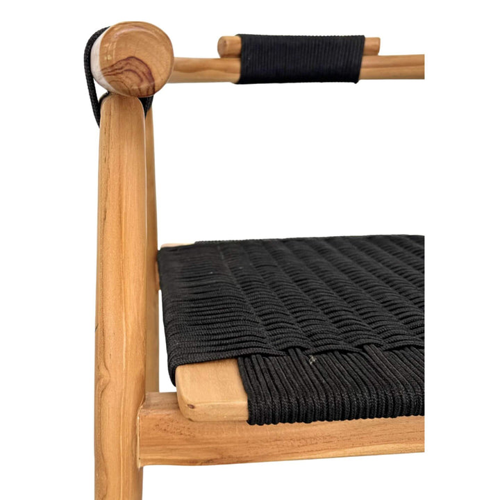 Close-up of Baros Dining Chair armrest in teak wood with wrapped black rope detail.