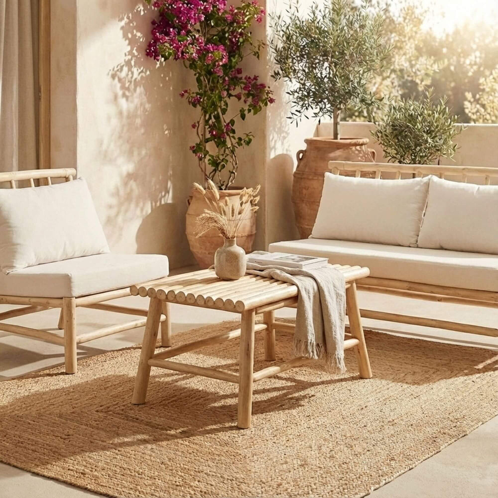 Styled outdoor seating area featuring the Batang coffee table in a natural terrace setting.