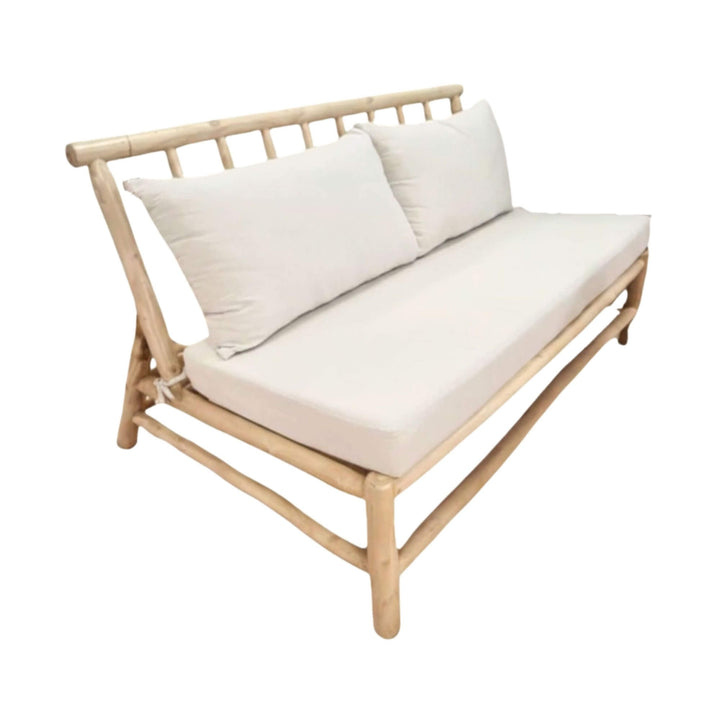 Angled view of the Batang sofa highlighting the teak branch construction.