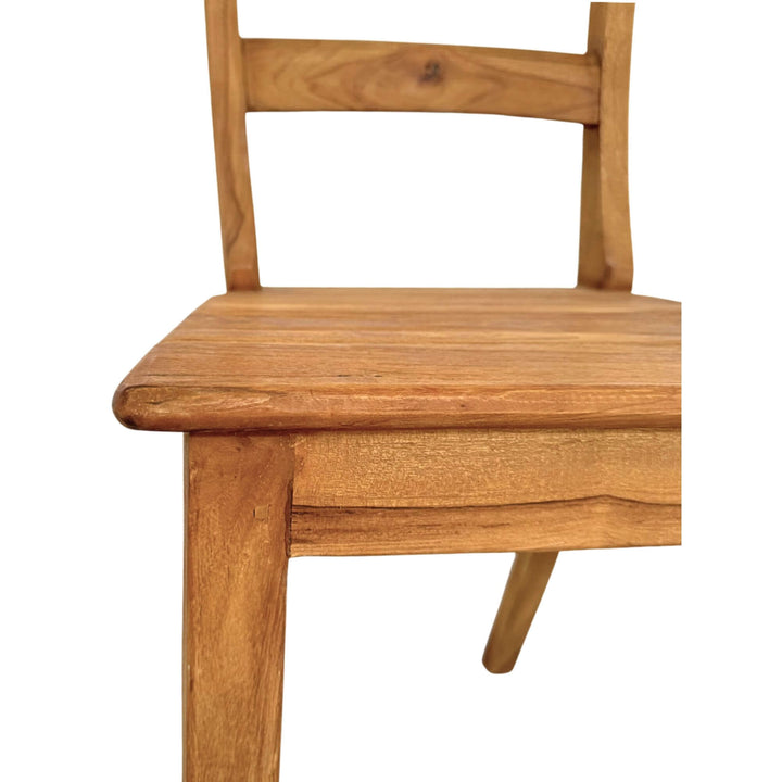 Close-up of the lower back support and seat edge of the Batauga dining chair.