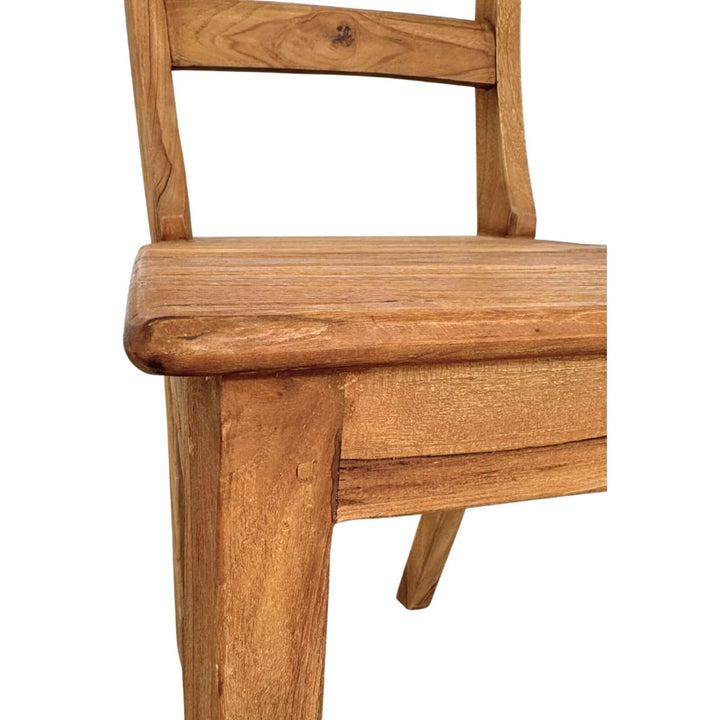 Detail shot of the seat and front frame of the Batauga Teak Round Dining Chair.