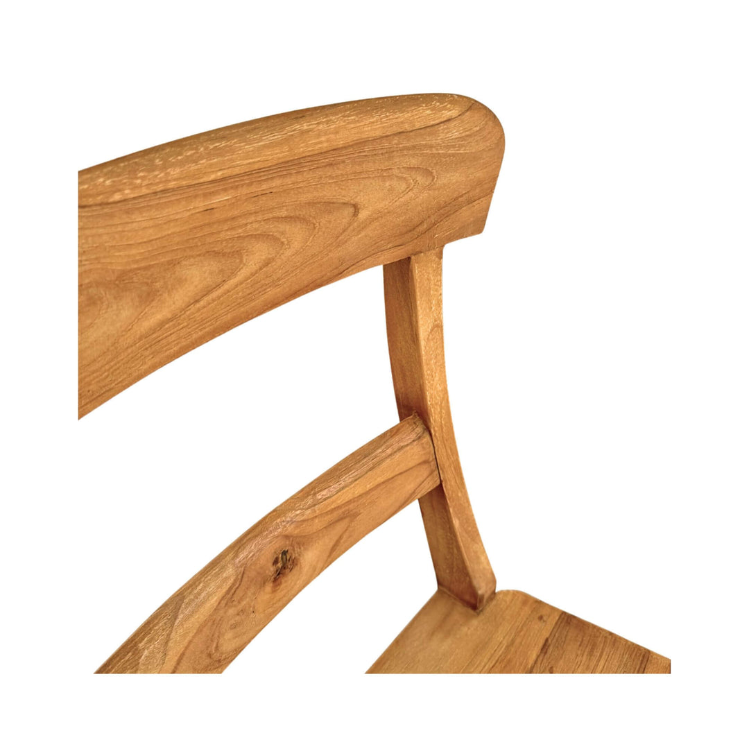 Close-up of the curved backrest of the Batauga Teak Round Dining Chair in natural teak wood.