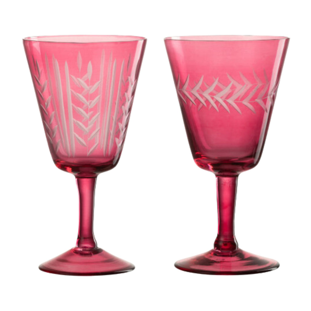 Pair of Bazaruto Glass Cup Pink pieces featuring etched patterns and tall stems.