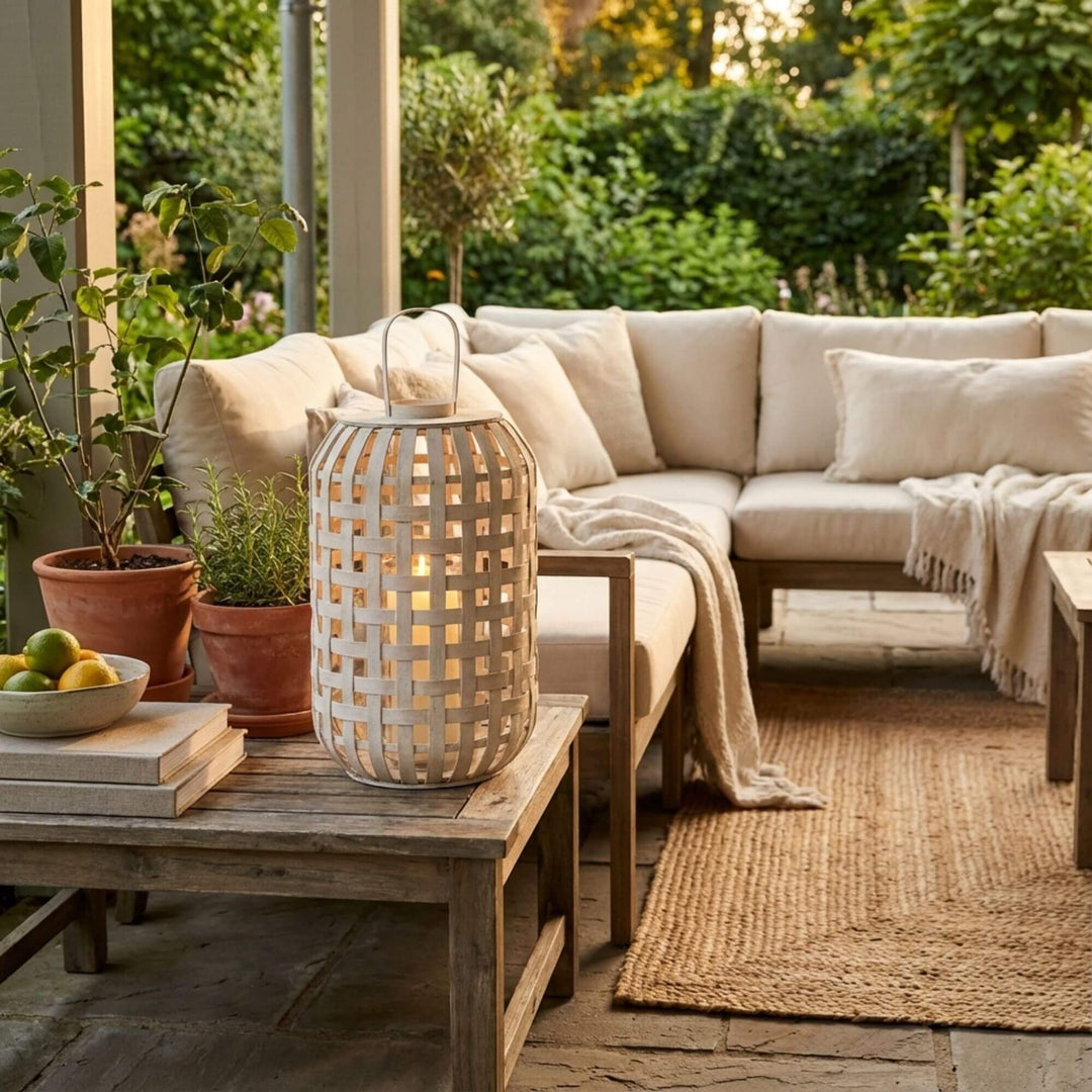 Styled interior setting featuring the Beach lantern placed on a wooden coffee table with soft ambient light.