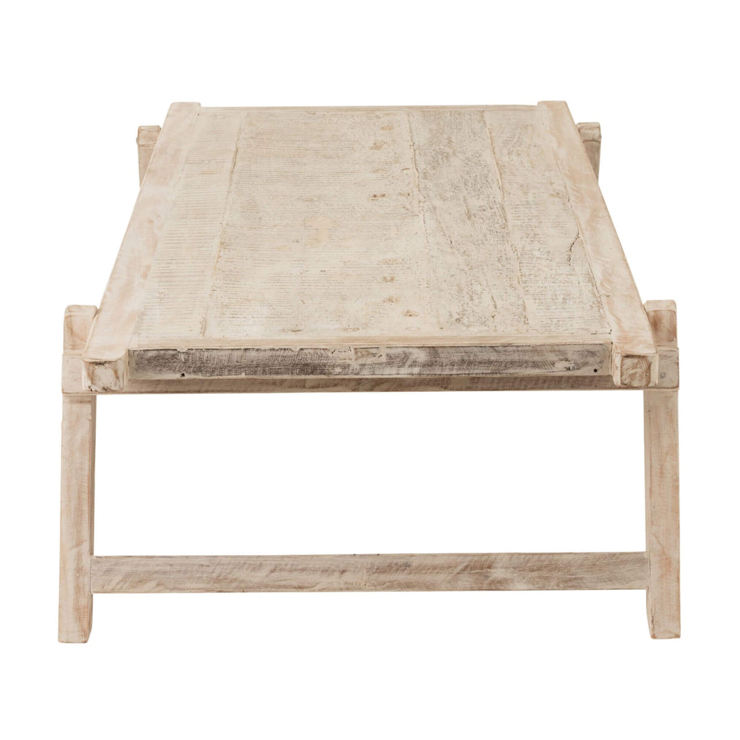 Side view of wooden frame and legs on Bianca coffee table
