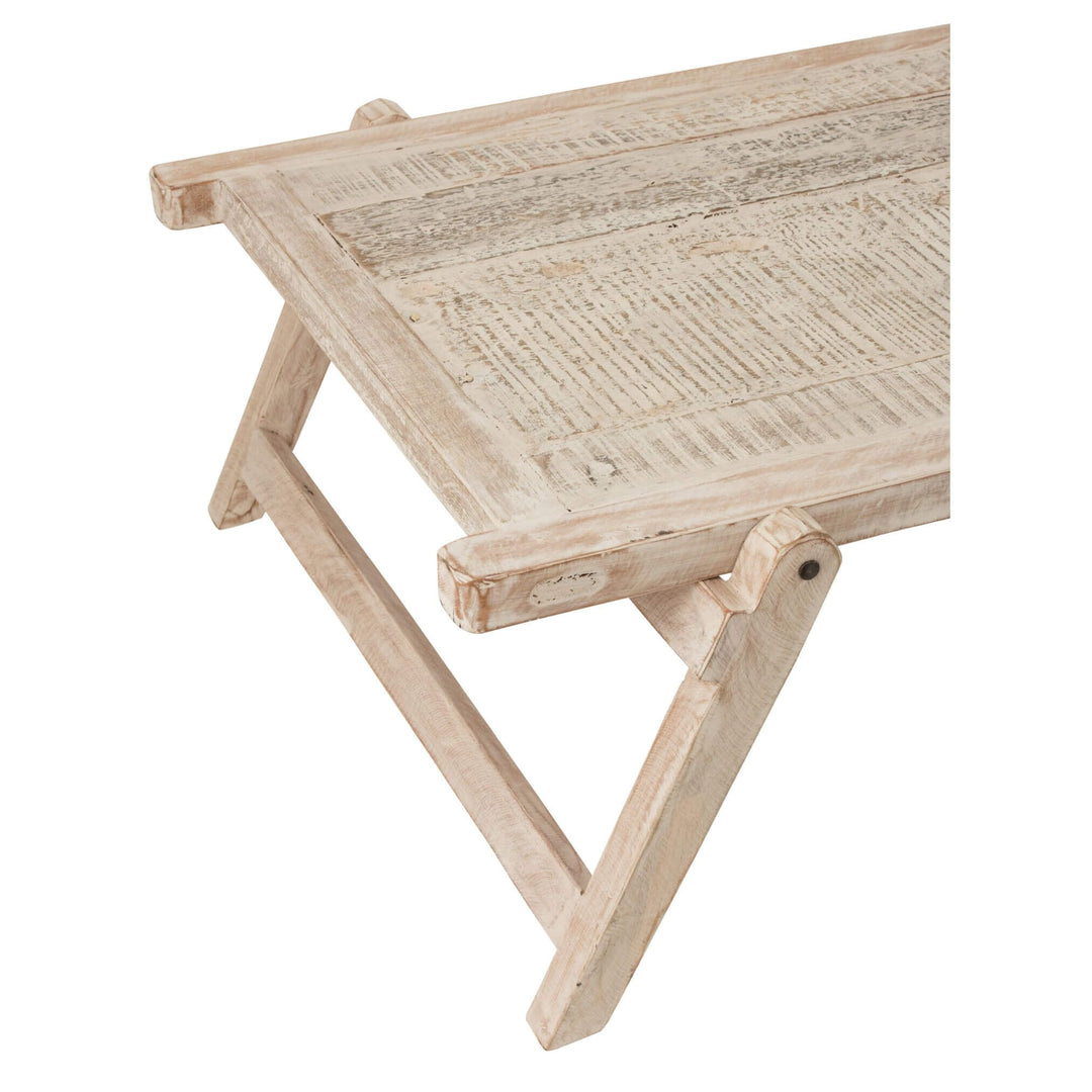 End view showing slim profile and woven-texture top of Bianca table