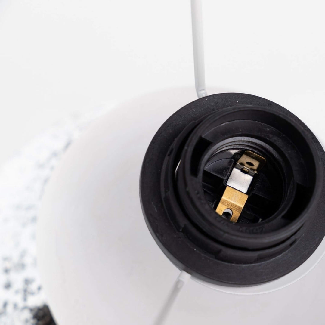 Close-up of the lamp socket and shade interior showing the functional top detail of the Bianca table lamp.