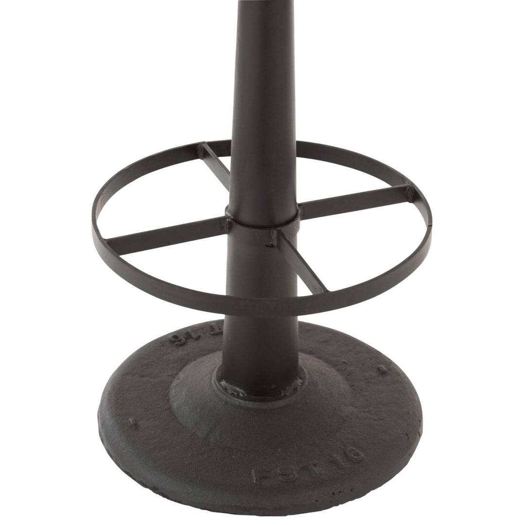 Close-up of the black iron base and footrest of the Bill Bar Stool.