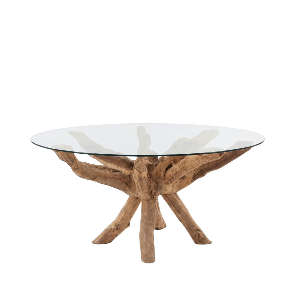 Front view of the Bintan teak root dining table with round glass top.