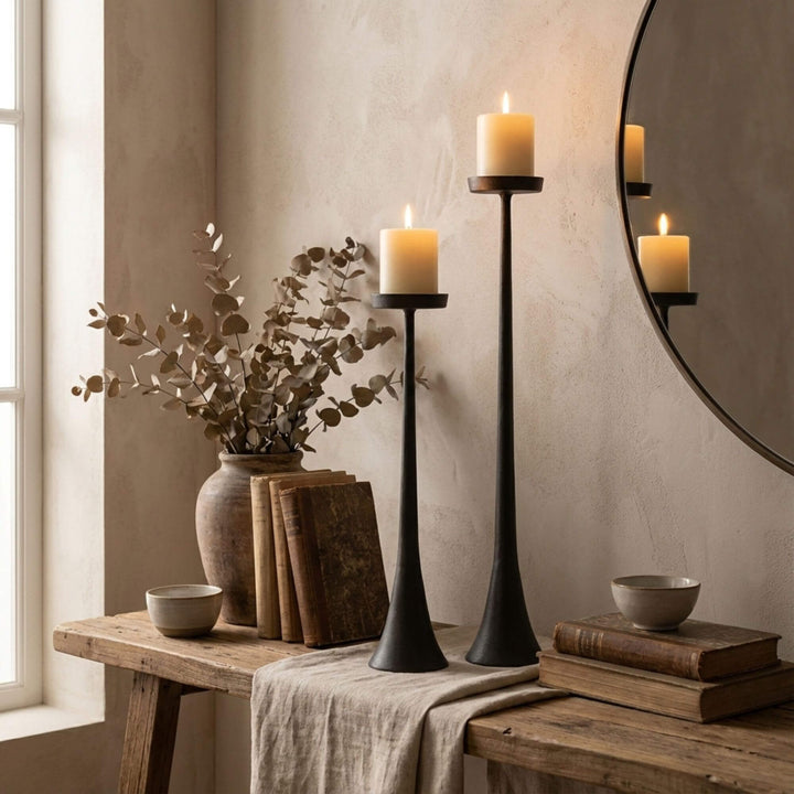Styled interior view of Black Candle Stands placed on a console table creating a soft, modern ambiance.