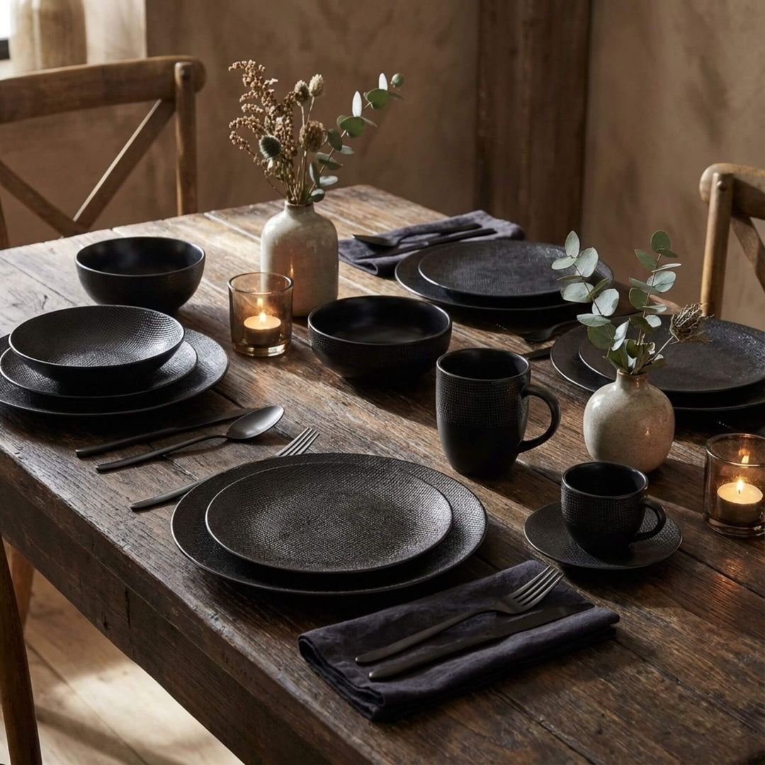 Styled dining table featuring the Black Vesuvio ceramic tableware collection.