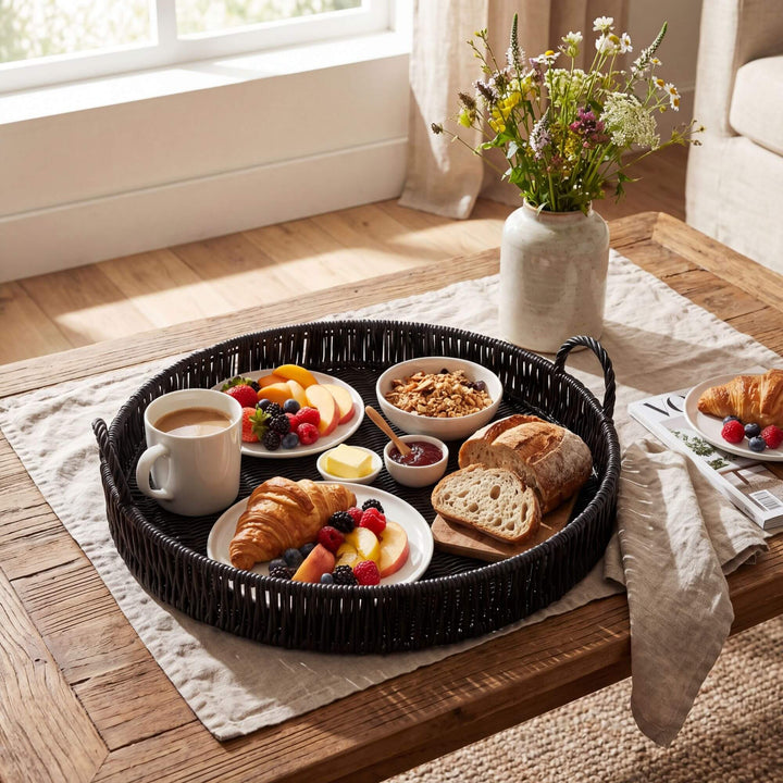 Styled table setting featuring the black round tray used for serving breakfast and drinks.