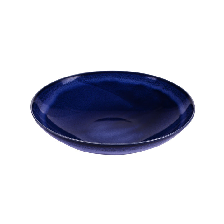 Side view of blue ceramic bowl highlighting depth and smooth handcrafted finish.