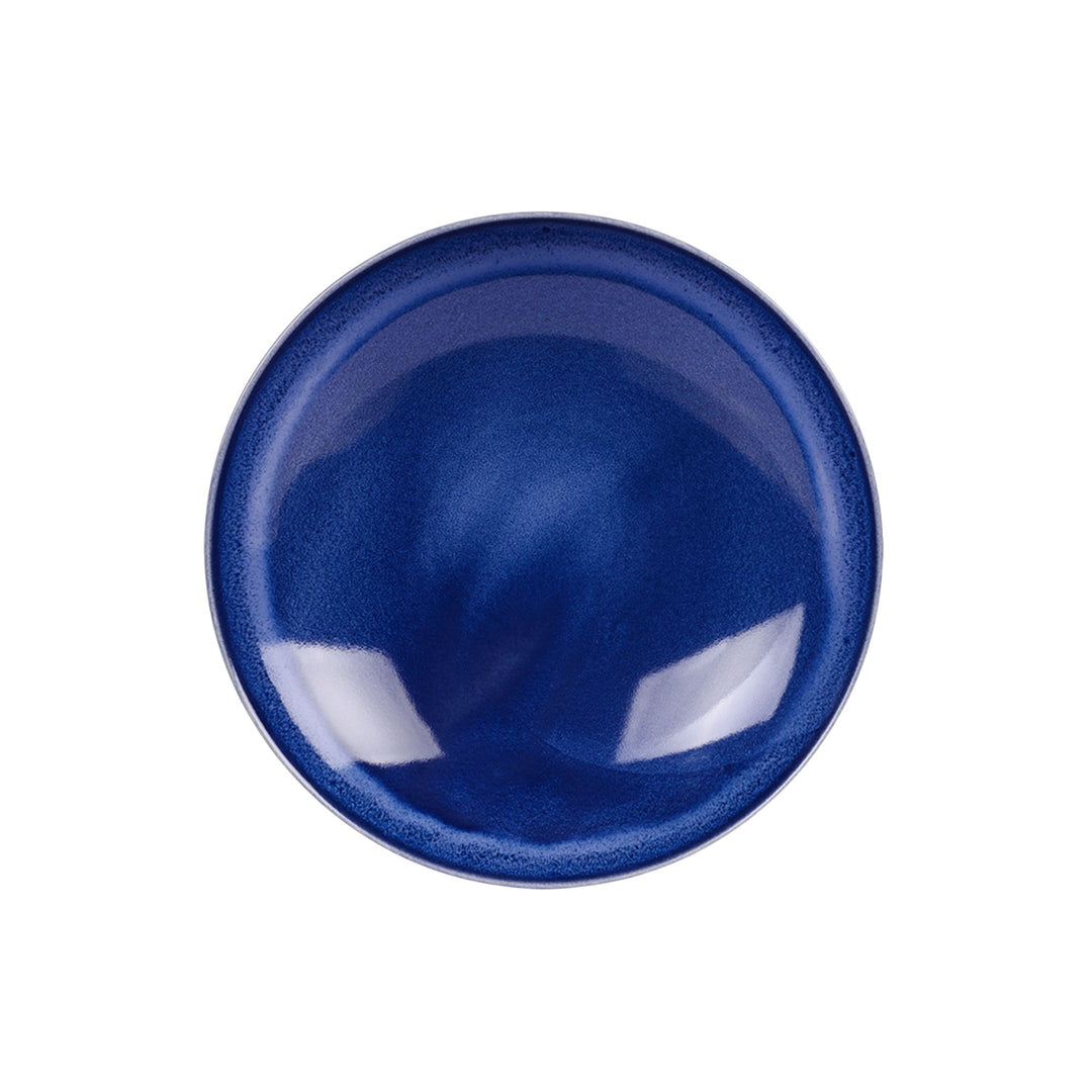 Top view of blue ceramic bowl highlighting depth and smooth handcrafted finish.
