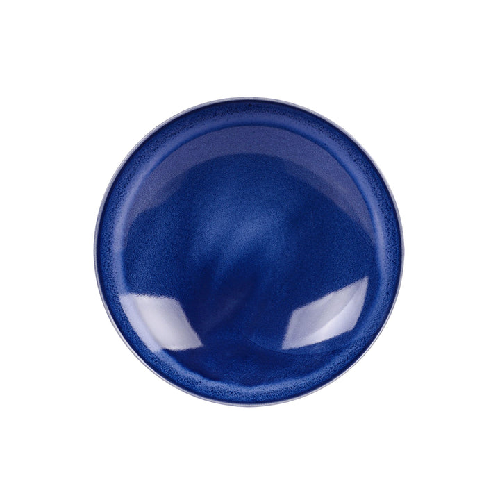 Top view of blue ceramic bowl highlighting depth and smooth handcrafted finish.
