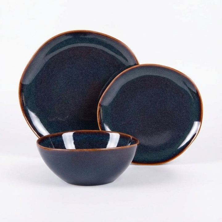 Blue Symphony ceramic tableware set with plates and bowl in deep blue glaze.