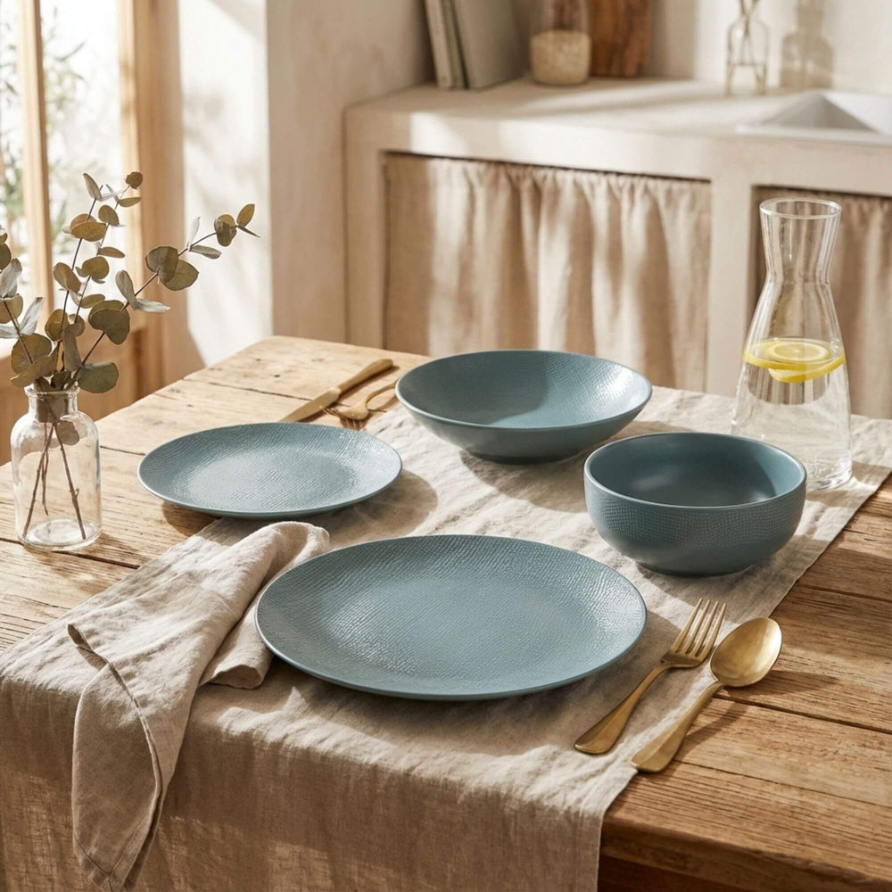 Styled dining table featuring the Blue Vesuvio ceramic tableware collection.